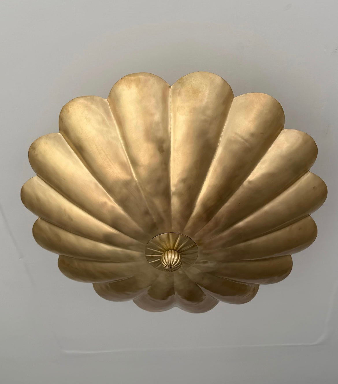 Brushed brass lotus-inspired ceiling light