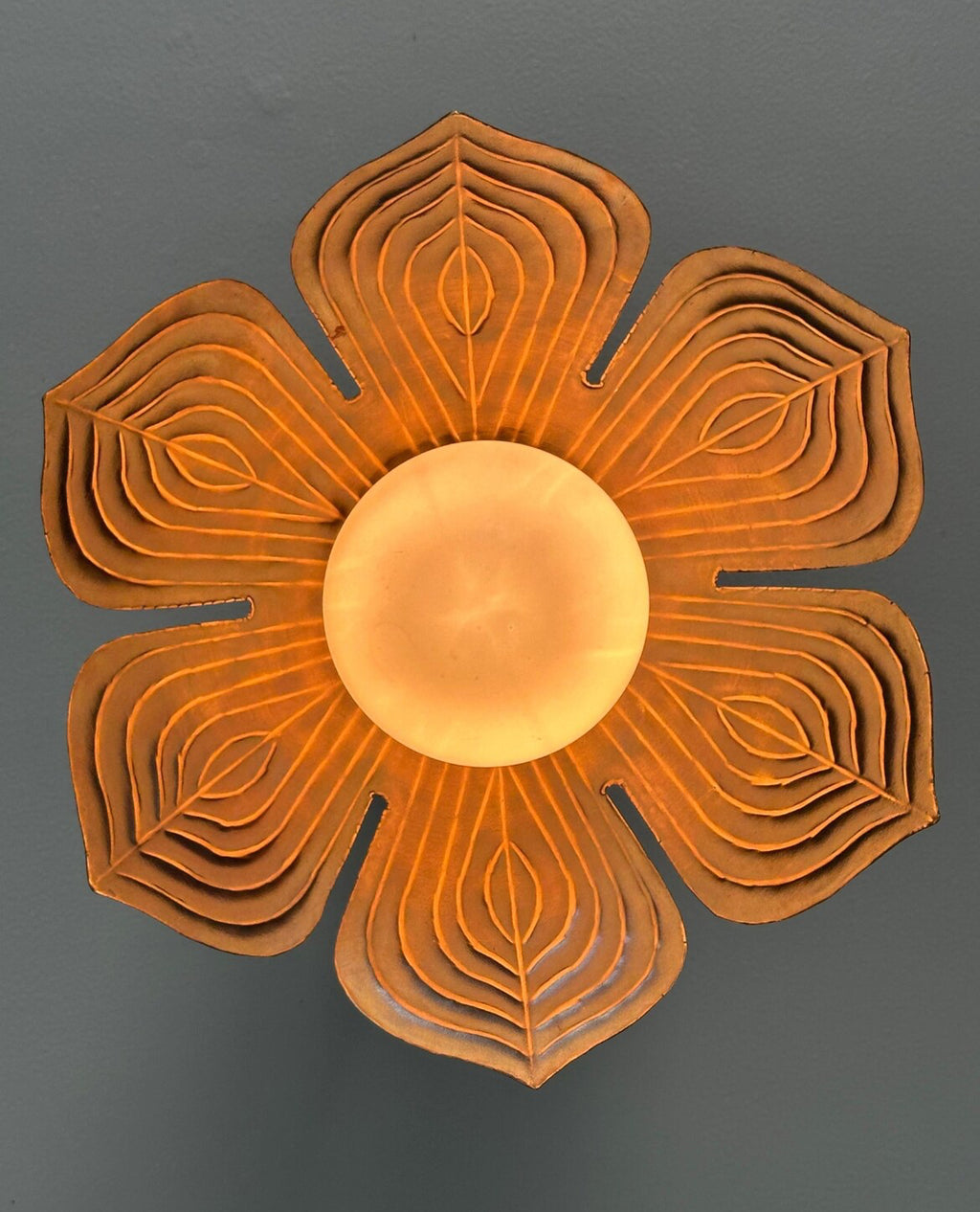 Antique brass lotus flower flush mount ceiling light with glowing glass globe