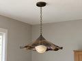 Antique brass scalloped flower bowl pendant light with frosted glass globe in living room