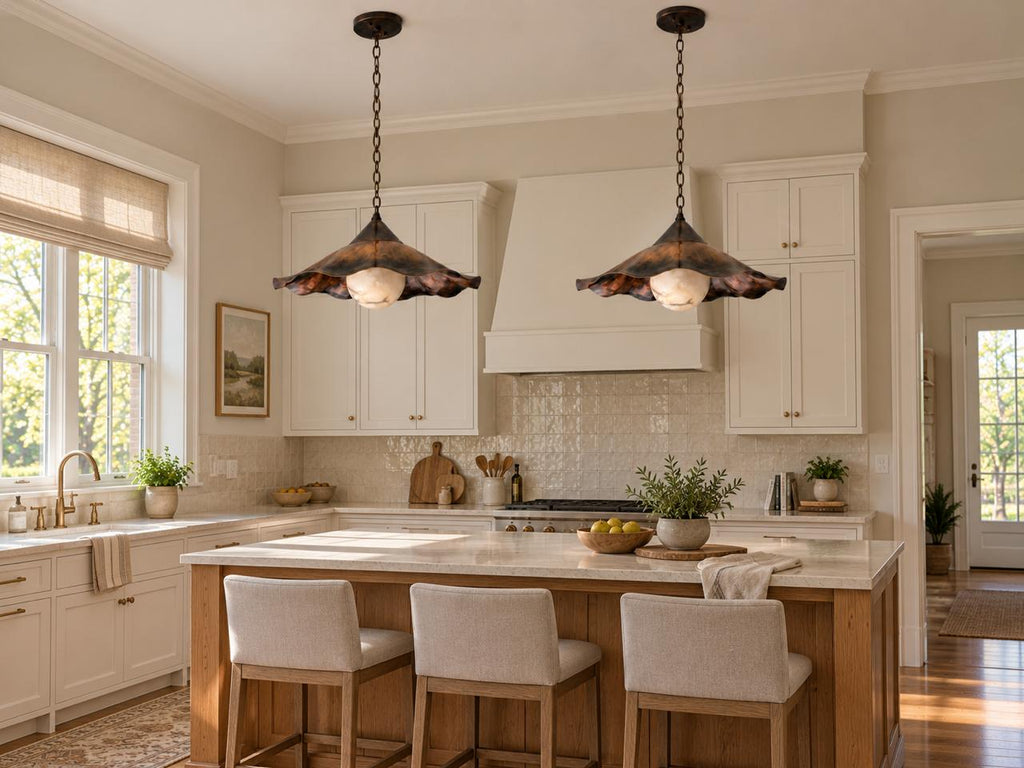 Two ruffled brass pendant lights over kitchen island