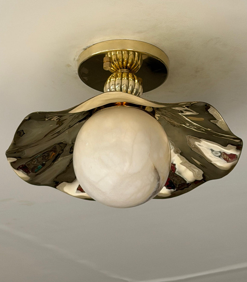 wavy flush mount light with alabaster globe close up picture