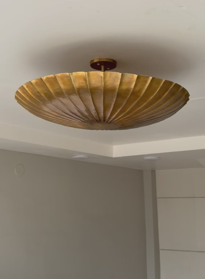 Brass ribbed flush mount light for living room