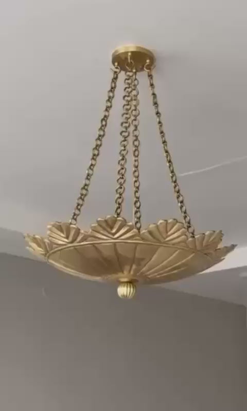 Brushed brass scallop pendant light close-up